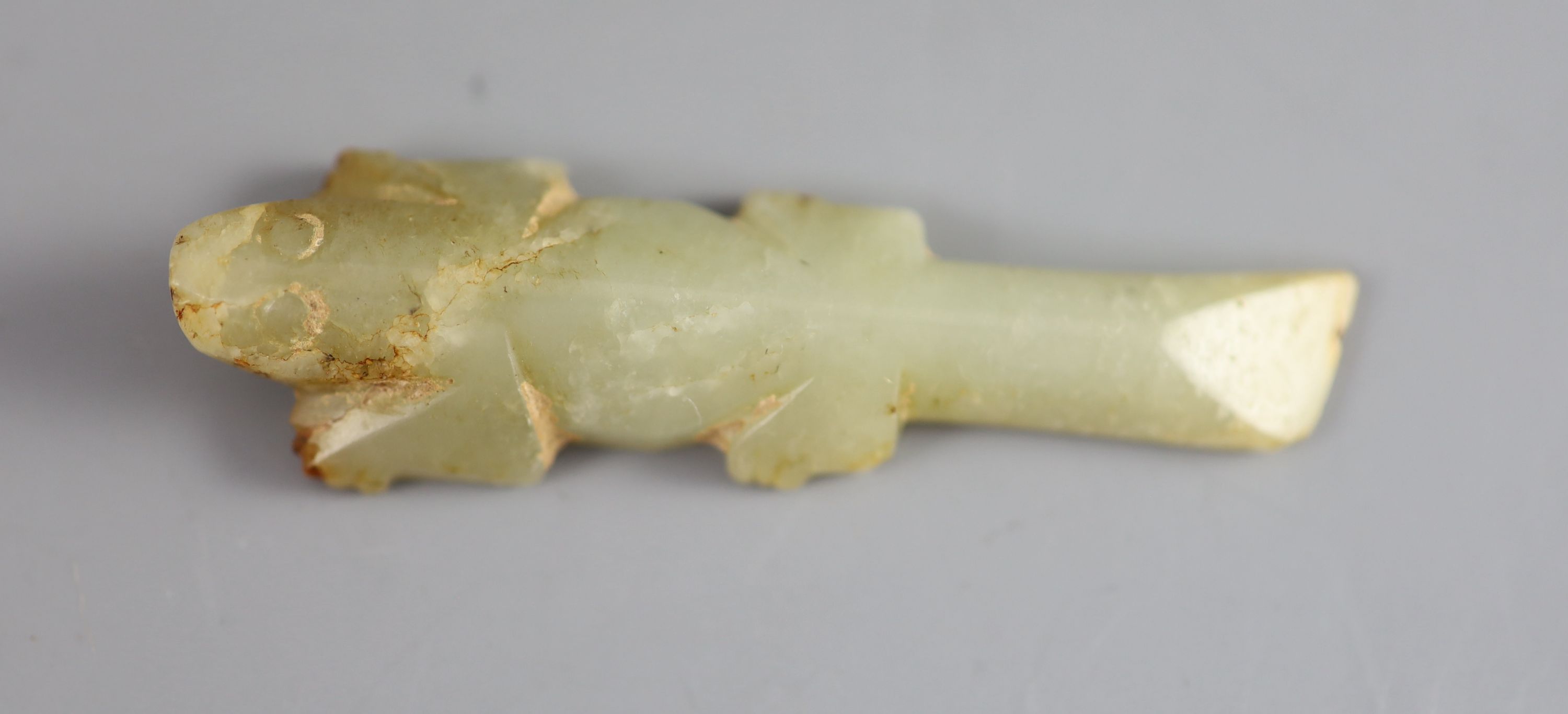 A Chinese archaic celadon jade figure of a crocodile, 6.1 cm